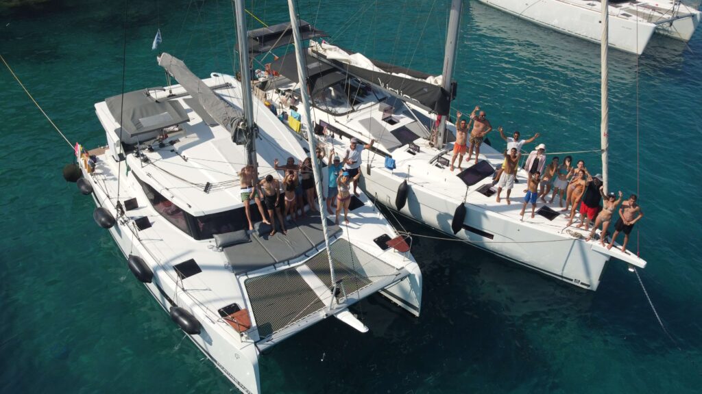 FP Isla 40 and Dufour 530 docked side by side in a beautiful turquoise bay in Lindos, Rhodes Island, Greece